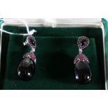 18ct white gold onyx, ruby and diamond set drop earrings.