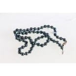 Double strand of blue and grey stained freshwater cultured pearls and another set,