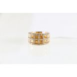 18ct yellow gold yellow sapphire and diamond set grid dress ring.