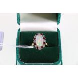 18ct yellow and white gold opal, ruby and diamond set cluster ring.