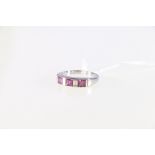 18ct white gold pink sapphire and diamond set half-hoop eternity ring.