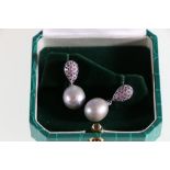 18ct white gold freshwater cultured pearl and sapphire drop earrings.