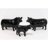 Three Beswick figures: Aberdeen Angus Bull, no. 1562, 11.9cm high; Aberdeen Angus Cow, no. 1563, 10.