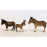 Three Beswick figures: Donkey, no. 2267A, 14cm high; Donkey, no.