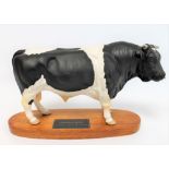 Beswick figure: Friesian Bull - On wooden plinth, no. A2580, black and white satin matt, 19cm high.