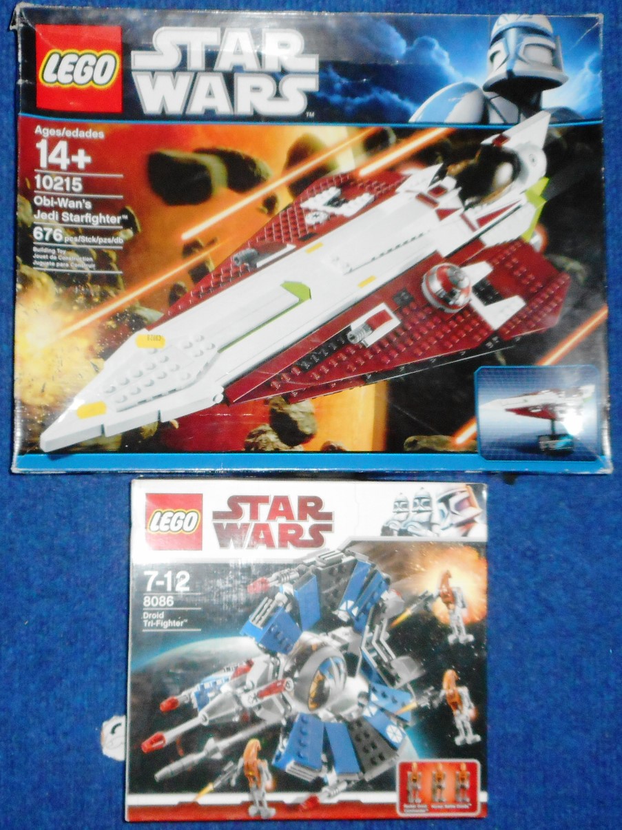 Lego. Two Star Wars sets. 8086 & 10215. No internal packaging . Not known if complete.