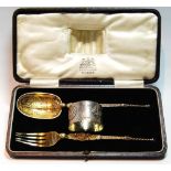 Silver parcel gilt christening set comprising a spoon and fork modelled after the Anointing Spoon
