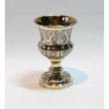 Silver parcel gilt small cup with lobed engraved flowers on inscribed foot,