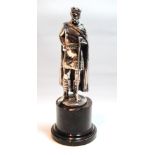 19th century silvered copper figure of King Arthur grasping a staff, on serpentine plinth,