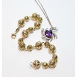 Diamond and amethyst pendant in white gold and a yellow gold bracelet, both '.375', 9.4g.