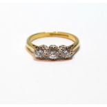 Diamond three-stone ring, the brilliants approximately .3ct and .2ct, in 18ct gold, 1976, size P, 3.