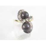 Dress ring with two black pearls each approx. 7mm with baguette diamonds in gold, '18ct'.