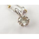 Diamond solitaire pendant, approx. .6ct on yellow and white gold beaded necklace, all 18ct.