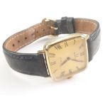 Gent's Omega de Ville rolled gold watch of bowed square shape on strap.