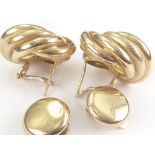 Pair of 9ct gold ear clips of whorl form and a pair of button ear clips. Condition Report.