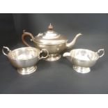 Silver three piece tea set, hemispherical with beaded edges, Birmingham 1930.