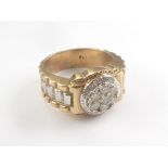 Gent's diamond ring with a cluster of seven brilliants in 9ct gold. Size 'T'.