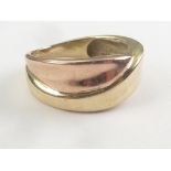 Two colour gold band ring of swirling form, probably 14ct. Size 'N'. Condition Report.