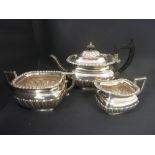 Silver three piece tea set of waved fluted form, crested, by Elkington & Co. Birmingham, 1899.