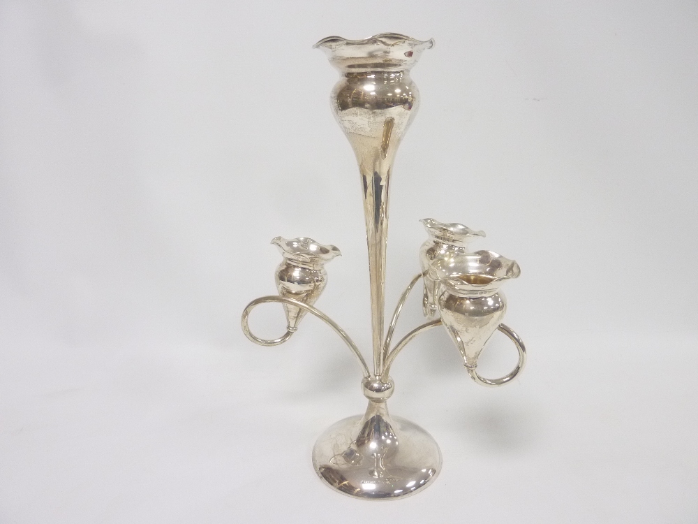 Silver epergne of Art Nouveau style with three tulip shaped vases and another,