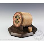 A 'Dewhurst's Machine Twist' oversized advertising cotton reel, on octagonal oak base,