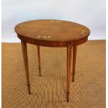 An Edwardian Sheraton revival painted satinwood oval table, in the manner of Edwards and Roberts,