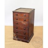 An early 19th century mahogany chest, with faux drawer fall front over four drawers, on plinth base,