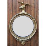 A large Regency gilt wood and gesso convex wall mirror, of large proportions,
