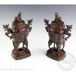 A pair of Japanese bronze vases and covers, Meiji period,