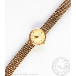 A lady's 9ct gold Rotary wristwatch, the champagne circular baton dial, with mesh link bracelet,