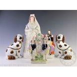 A Staffordshire figure of Queen Victoria, titled 'Queen of England', gilt highlighted 43cm H,