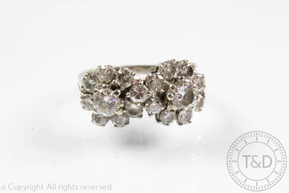 A diamond set double cluster ring,