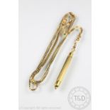 A Victorian yellow metal long chain with attached propelling pencil,