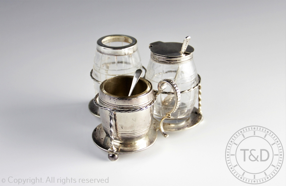 A silver three piece condiment set retailed by Dobsons Piccadilly, Frederick Brasted, London 1866,