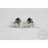 A pair of diamond set stud earrings, each set with a brilliant cut diamond (of approx 0.