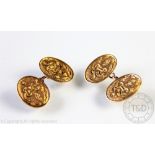 A pair of 15ct yellow gold cufflinks, Birmingham 1911, with entwined knot engraved decoration,