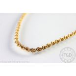 A 9ct gold chain, the uniform rope twist chain with bolt ring clasp, weight 15.