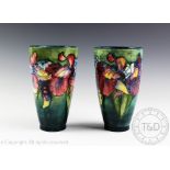 A pair of Moorcroft Iris pattern vases,