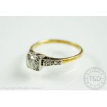 An Art Deco style solitaire diamond ring, the brilliant cut diamond (measuring approx 0.