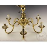 A Dutch style brass chandelier, with six sconce arms,