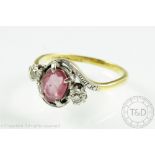 A pink sapphire and diamond three stone cross-over ring,