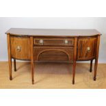 A George III style inlaid mahogany breakfront sideboard,