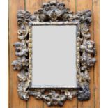 An 18th century Italian Florentine style carved wood and gesso wall mirror,