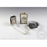 A selection of silver comprising; a Victorian silver shell shaped salt, Josiah Williams & Co,