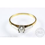 A diamond solitaire ring, the mine cut diamond within four claw setting,
