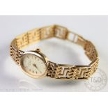 A lady's 9ct gold Rotary wristwatch, the champagne oval baton dial,