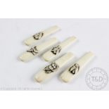 A set of five Japanese carved bone handles, each carved with an insect and unmounted, signed,