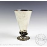A silver vase Charles Boyton London 1936, of conical form with planished finish,