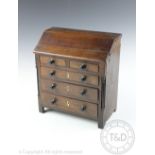 A 19th century mahogany and pine apprentice bureau, with two short and three long drawers,