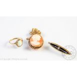 A carved shell cameo brooch with 9ct yellow gold surround, an opal ring in '9ct' setting,